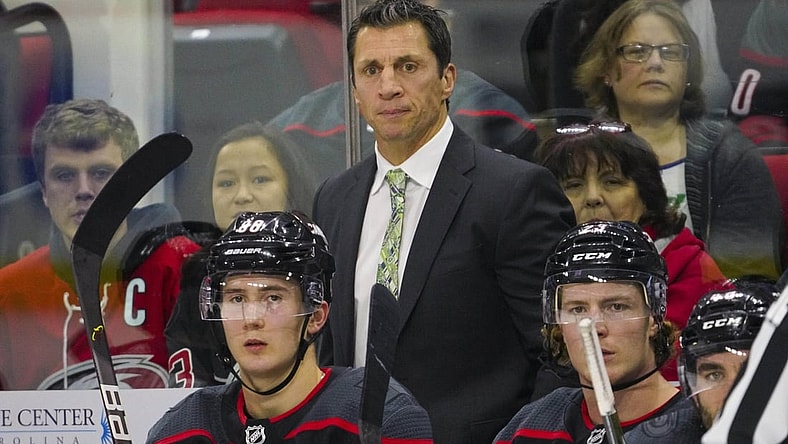 Dec 31, 2019; Raleigh, North Carolina, USA;  Carolina Hurricanes head coach Rod Brind'Amour looks on from behind the players bench against the Montreal Canadiens at PNC Arena. The Carolina Hurricanes defeated the Montreal Canadiens 3-1. Mandatory Credit: James Guillory-USA TODAY Sports