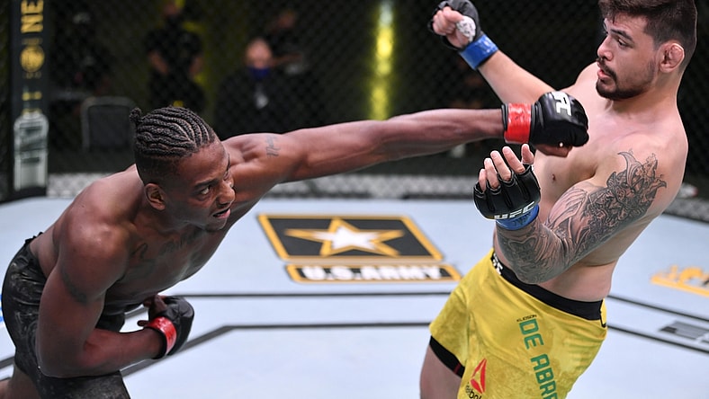 May 30, 2020; Las Vegas, NV, USA; Jamahal Hill (red gloves) punches Klidson Abreu of Brazil (blue gloves) in their light heavyweight fight during UFC Fight Night.  Mandatory Credit: Jeff Bottari/Zuffa via USA TODAY Sports