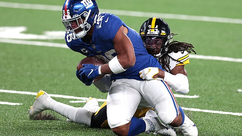 Sep 14, 2020; East Rutherford, New Jersey, USA; New York Giants running back Saquon Barkley (26) is tackled by Pittsburgh Steelers strong safety Terrell Edmunds (34) during the second half at MetLife Stadium. Mandatory Credit: Vincent Carchietta-USA TODAY Sports
