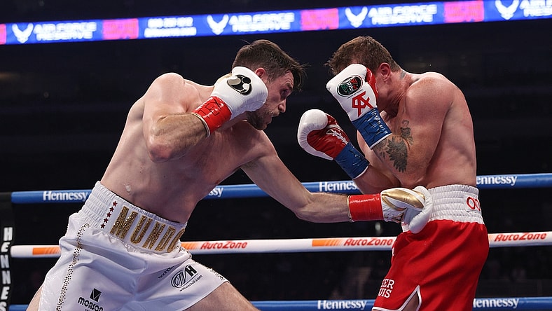 Dec 19, 2020; San Antonio, TX, USA; Canelo Alvarez (red trunks) and Callum Smith (white trunks) during their WBA, WBC and Ring Magazine super middleweight championship bout at the Alamodome in San Antonio, TX. Mandatory Credit: Ed Mulholland/Handout Photo via USA TODAY Sports