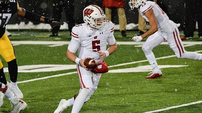Dec 12, 2020; Iowa City, Iowa, USA; Wisconsin Badgers quarterback Graham Mertz (5) in action during the game against the Iowa Hawkeyes at Kinnick Stadium. Mandatory Credit: Jeffrey Becker-USA TODAY Sports