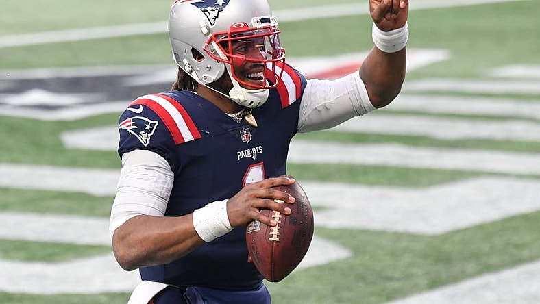 Jan 3, 2021; Foxborough, Massachusetts, USA; New England Patriots quarterback Cam Newton (1) celebrates after scoring a touchdown against the New York Jets during the third quarter at Gillette Stadium. Mandatory Credit: Brian Fluharty-USA TODAY Sports