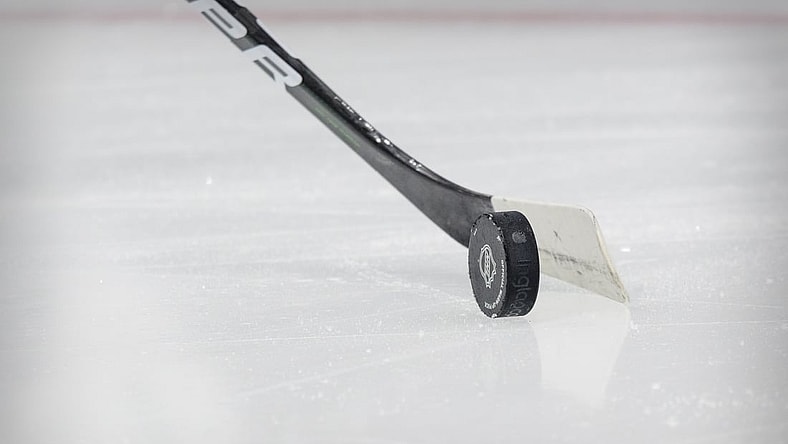 Mar 16, 2021; Dallas, Texas, USA; A view of an NHL puck and hockey stick before the game between the Dallas Stars and the Tampa Bay Lightning at the American Airlines Center. Mandatory Credit: Jerome Miron-USA TODAY Sports