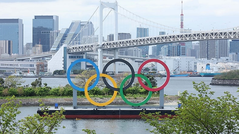 Apr 6, 2021; Tokyo, JAPAN; General view of the Olympic rings sculpture, Rainbow Bridge, and Tokyo Tower as seen from Odaiba in preparation for the Tokyo 2020 Olympic Summer Games set to begin in July 2021. Mandatory Credit: Yukihito Taguchi-USA TODAY Sports