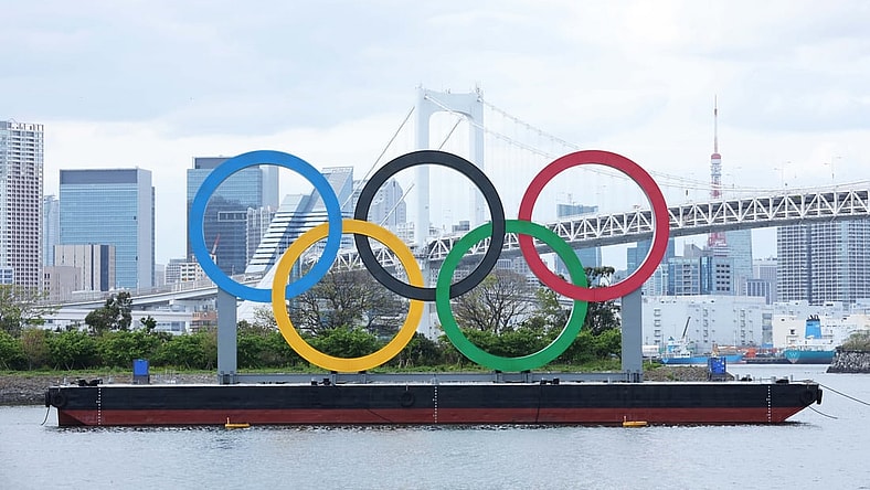 Apr 6, 2021; Tokyo, JAPAN; General view of the Olympic rings sculpture, Rainbow Bridge, and Tokyo Tower as seen from Odaiba in preparation for the Tokyo 2020 Olympic Summer Games set to begin in July 2021. Mandatory Credit: Yukihito Taguchi-USA TODAY Sports