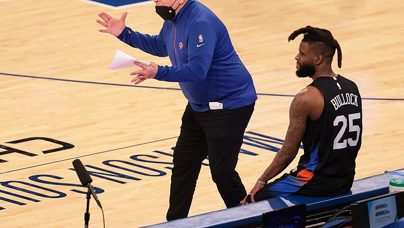 Apr 28, 2021; New York, New York, USA; New York Knicks head coach Tom Thibodeau  reacts during the second quarter against the Chicago Bulls in front of forward Reggie Bullock (25) at Madison Square Garden. Mandatory Credit: Vincent Carchietta-USA TODAY Sports