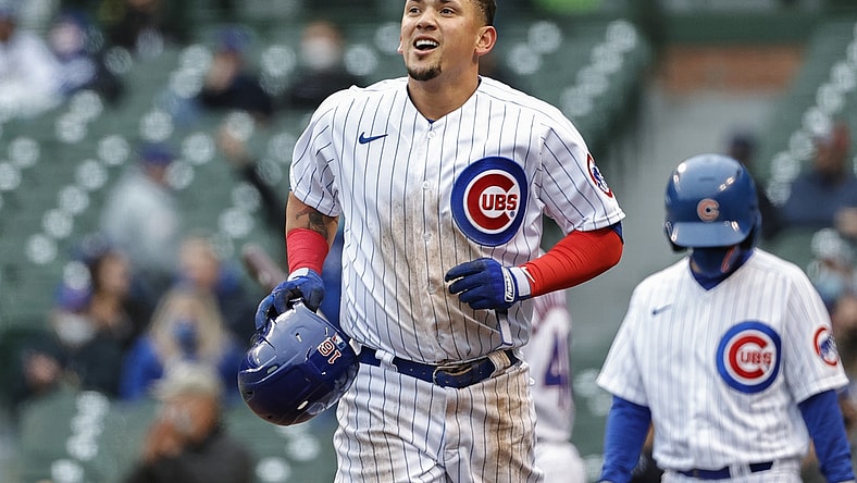 May 4, 2021; Chicago, Illinois, USA; Chicago Cubs second baseman Ildemaro Vargas (16) smiles after scoring against the Los Angeles Dodgers during the third inning of the first game of a doubleheader at Wrigley Field. Mandatory Credit: Kamil Krzaczynski-USA TODAY Sports