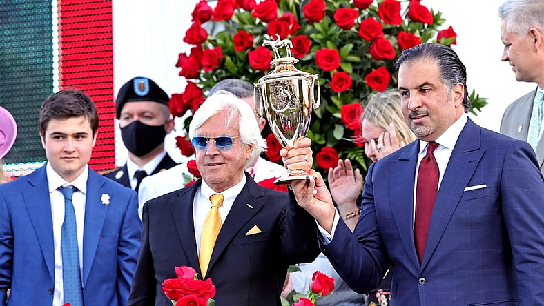 May 1, 2021; Louisville, Kentucky, USA; Medina Spirit owner Amr F. Zedan (right) and trainer Bob Baffert hold the trophy after winning the 147th running of the Kentucky Derby at Churchill Downs. Mandatory Credit: Jim Owens-USA TODAY Sports