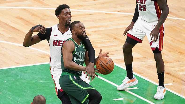 May 11, 2021; Boston, Massachusetts, USA; Miami Heat center Bam Adebayo (13) fouls Boston Celtics guard Kemba Walker (8) in the third quarter at TD Garden. Mandatory Credit: David Butler II-USA TODAY Sports