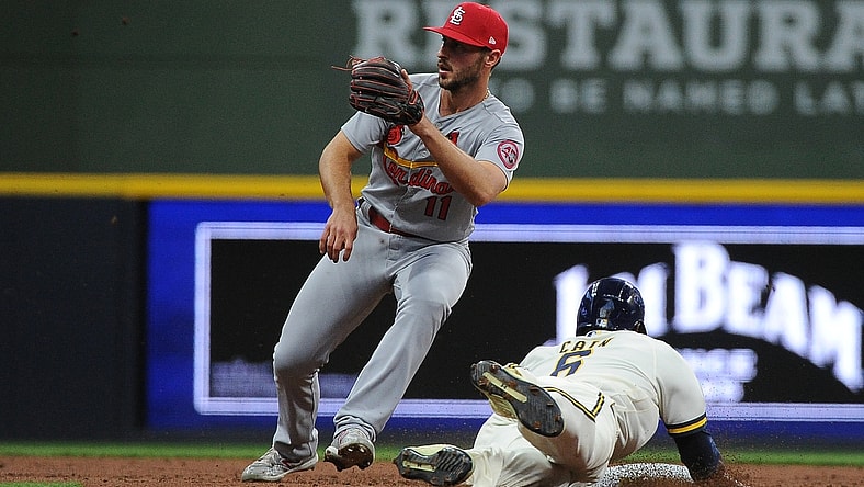May 12, 2021; Milwaukee, Wisconsin, Milwaukee Brewers center fielder Lorenzo Cain (6) steals second base ahead of the tag of St. Louis Cardinals shortstop Paul DeJong (11) in the third inning at American Family Field. Mandatory Credit: Michael McLoone-USA TODAY Sports