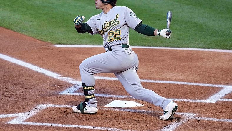 May 22, 2021; Anaheim, California, USA; Oakland Athletics center fielder Ramon Laureano (22) follows through on a single against the Los Angeles Angels in the first inning at Angel Stadium. Mandatory Credit: Kirby Lee-USA TODAY Sports