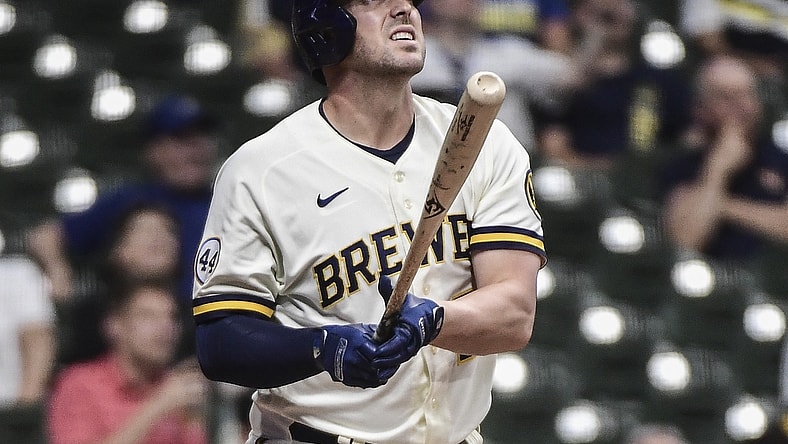 May 25, 2021; Milwaukee, Wisconsin, USA; Milwaukee Brewers third baseman Travis Shaw (21) watches his solo home run during the seventh inning against the San Diego Padres at American Family Field. Mandatory Credit: Benny Sieu-USA TODAY Sports