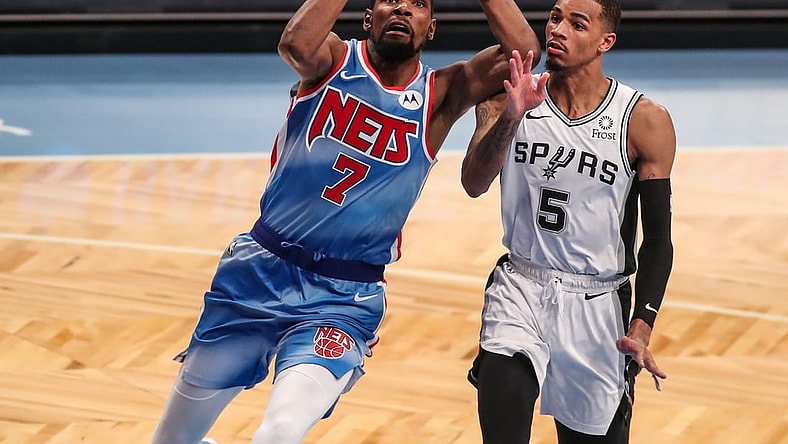 May 12, 2021; Brooklyn, New York, USA; Brooklyn Nets forward Kevin Durant (7) and San Antonio Spurs guard Dejounte Murray (5) at Barclays Center. Mandatory Credit: Wendell Cruz-USA TODAY Sports