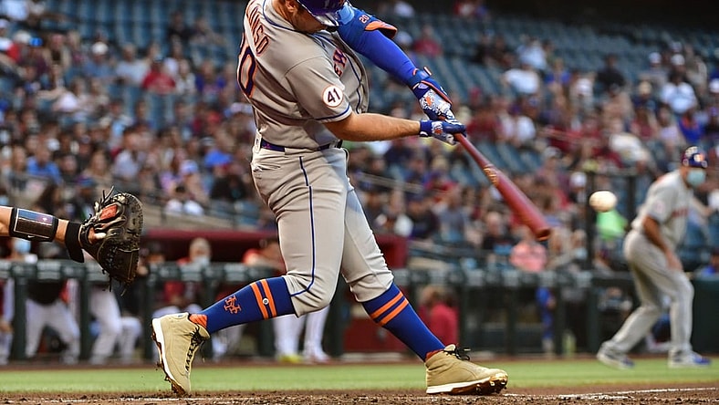 May 31, 2021; Phoenix, Arizona, USA; New York Mets first baseman Pete Alonso (20) hits a two-run RBI single in the third inning against the Arizona Diamondbacks at Chase Field. Mandatory Credit: Matt Kartozian-USA TODAY Sports