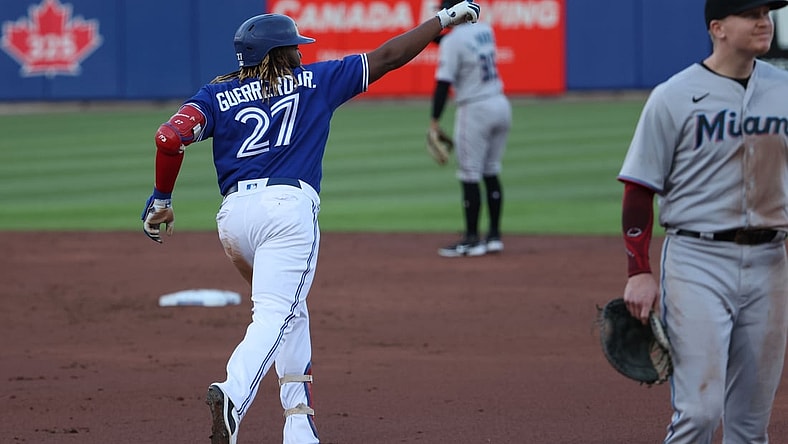 Jun 1, 2021; Buffalo, New York, USA;  Toronto Blue Jays first baseman Vladimir Guerrero Jr. (27) celebrates his home run during the third inning against the Miami Marlins at Sahlen Field. Mandatory Credit: Timothy T. Ludwig-USA TODAY Sports
