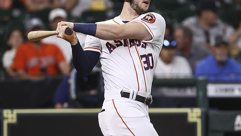 Jun 1, 2021; Houston, Texas, USA; Houston Astros right fielder Kyle Tucker (30) hits a double during the second inning against the Boston Red Sox at Minute Maid Park. Mandatory Credit: Troy Taormina-USA TODAY Sports