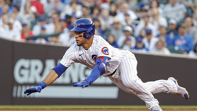 Jun 1, 2021; Chicago, Illinois, USA; Chicago Cubs catcher Willson Contreras (40) slides to second base after hitting a double against the San Diego Padres during the third inning at Wrigley Field. Mandatory Credit: Kamil Krzaczynski-USA TODAY Sports