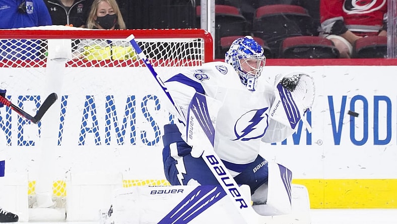 Jun 1, 2021; Raleigh, North Carolina, USA; Tampa Bay Lightning goaltender Andrei Vasilevskiy (88) gets ready to make a glove save against the Carolina Hurricanes in game two of the second round of the 2021 Stanley Cup Playoffs at PNC Arena. Mandatory Credit: James Guillory-USA TODAY Sports