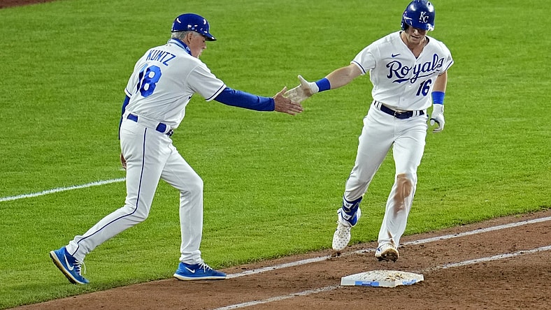 Jun 1, 2021; Kansas City, Missouri, USA; Kansas City Royals left fielder Andrew Benintendi (16) is congratulated by first base coach Rusty Kuntz (18) after hitting a grand slam against the Pittsburgh Pirates during the fifth inning at Kauffman Stadium. Mandatory Credit: Jay Biggerstaff-USA TODAY Sports