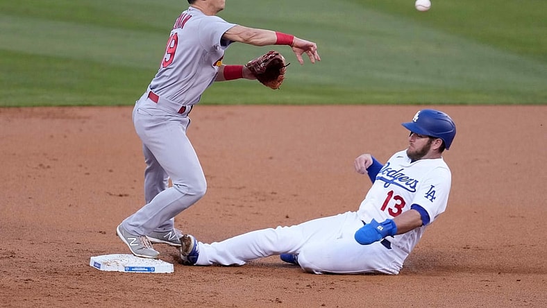 Jun 1, 2021; Los Angeles, California, USA; St. Louis Cardinals second baseman Tommy Edman (19) forces out Los Angeles Dodgers second baseman Max Muncy (13) out at second base in the first inning at Dodger Stadium. Mandatory Credit: Kirby Lee-USA TODAY Sports
