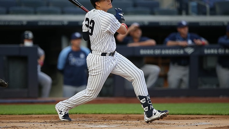 Jun 2, 2021; Bronx, New York, USA; New York Yankees third baseman Gio Urshela (29) follows through on a two run home run against the Tampa Bay Rays during the first inning at Yankee Stadium. Mandatory Credit: Brad Penner-USA TODAY Sports