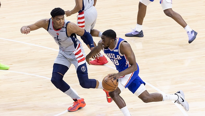 Jun 2, 2021; Philadelphia, Pennsylvania, USA; Philadelphia 76ers guard Shake Milton (18) dribbles the ball against Washington Wizards forward Rui Hachimura (8) during the second quarter in game five of the first round of the 2021 NBA Playoffs at Wells Fargo Center. Mandatory Credit: Bill Streicher-USA TODAY Sports