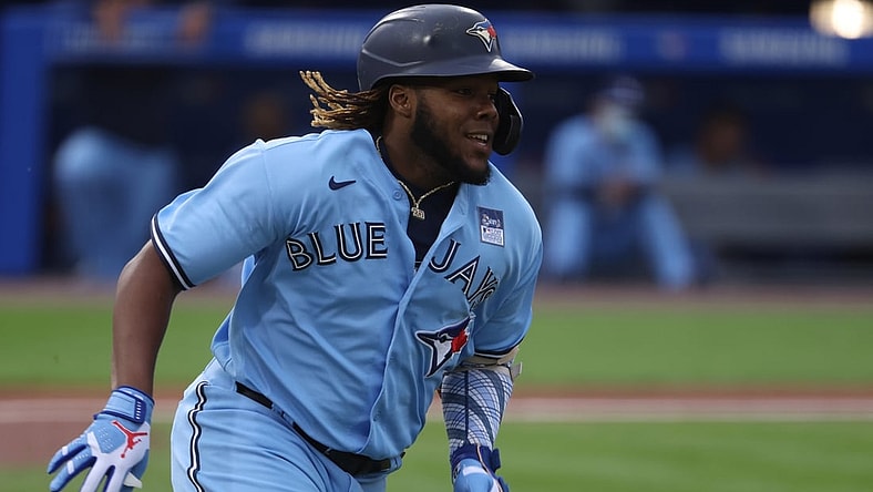 Jun 2, 2021; Buffalo, New York, USA; Toronto Blue Jays designated hitter Vladimir Guerrero Jr. (27) runs the bases after hitting a triple during the first inning against the Miami Marlins at Sahlen Field. Mandatory Credit: Timothy T. Ludwig-USA TODAY Sports