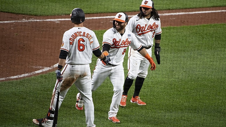 Jun 2, 2021; Baltimore, Maryland, USA;  Baltimore Orioles right fielder DJ Stewart (24) celebrate with third baseman Ryan Mountcastle (6) after hitting a two hun home run scoring  shortstop Freddy Galvis (2) in the fifth inning against the Minnesota Twins at Oriole Park at Camden Yards. Mandatory Credit: Tommy Gilligan-USA TODAY Sports