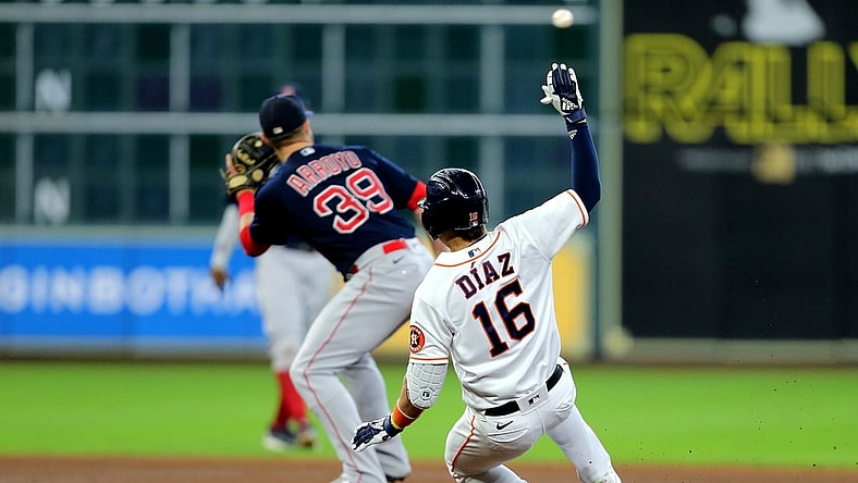 Jun 3, 2021; Houston, Texas, USA; Houston Astros shortstop Aledmys Diaz (16) slides into second base after hitting a double to left field against the Boston Red Sox during the first inning at Minute Maid Park. Mandatory Credit: Erik Williams-USA TODAY Sports