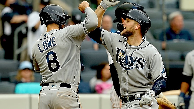 Jun 3, 2021; Bronx, New York, USA; Tampa Bay Rays designated hitter Austin Meadows (17) is congratulated by  second baseman Brandon Lowe (8) after hitting a two run home run against the New York Yankees during the fourth inning at Yankee Stadium. Mandatory Credit: Andy Marlin-USA TODAY Sports
