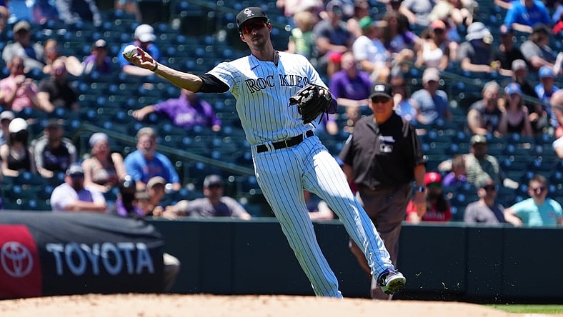 Jun 3, 2021; Denver, Colorado, USA; Colorado Rockies third baseman Joshua Fuentes (8) fields the ball in the second inning against the Texas Rangers at Coors Field. Mandatory Credit: Ron Chenoy-USA TODAY Sports