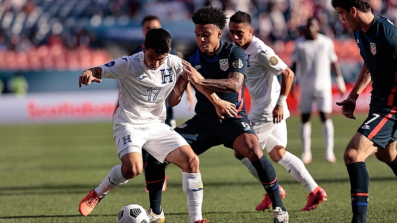 Jun 3, 2021; Denver, Colorado, USA; Honduras midfielder Jonathan Rubio (17) and United States midfielder Weston Mckennie (8) battle for the ball in the first half during the semifinals of the 2021 CONCACAF Nations League soccer series at Empower Field at Mile High. Mandatory Credit: Isaiah J. Downing-USA TODAY Sports