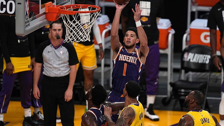 Jun 3, 2021; Los Angeles, California, USA; Phoenix Suns guard Devin Booker (1) shoots the ball in the first quarter against the Los Angeles Lakers during game six in the first round of the 2021 NBA Playoffs at Staples Center. Mandatory Credit: Kirby Lee-USA TODAY Sports