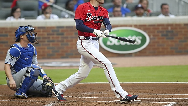 Jun 4, 2021; Atlanta, Georgia, USA;  Atlanta Braves first baseman Freddie Freeman (5) hits a home run against the Los Angeles Dodgers in the first inning at Truist Park. Mandatory Credit: Brett Davis-USA TODAY Sports
