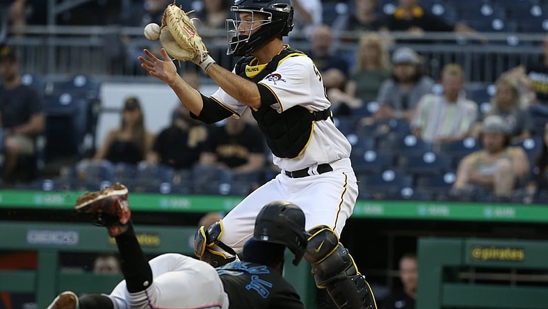 Jun 4, 2021; Pittsburgh, Pennsylvania, USA;  Pittsburgh Pirates catcher Jacob Stallings (58) takes a throw to force Miami Marlins shortstop Jazz Chisholm Jr. (2) out at home during the second inning at PNC Park. Mandatory Credit: Charles LeClaire-USA TODAY Sports
