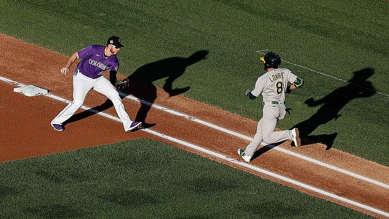 Jun 4, 2021; Denver, Colorado, USA; Oakland Athletics second baseman Jed Lowrie (8) runs towards the tag from Colorado Rockies first baseman C.J. Cron (25) in the first inning at Coors Field. Mandatory Credit: Isaiah J. Downing-USA TODAY Sports
