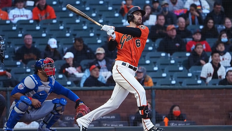Jun 4, 2021; San Francisco, California, USA; San Francisco Giants center fielder Steven Duggar (6) hits a two-run home run ahead of Chicago Cubs catcher Willson Contreras (40) during the second inning at Oracle Park. Mandatory Credit: Kelley L Cox-USA TODAY Sports