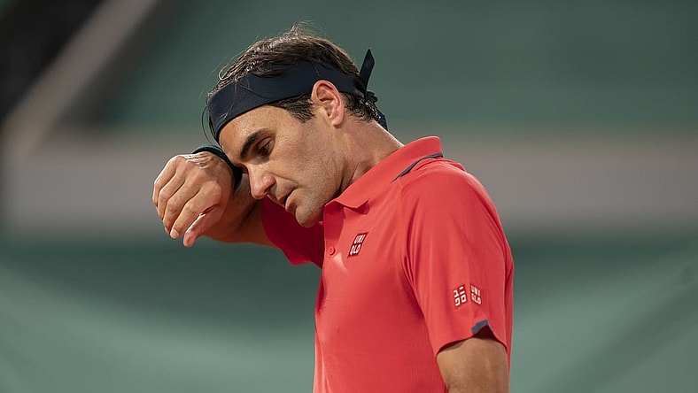 Jun 5, 2021; Paris, France; Roger Federer (SUI) wipes his brow during his match against Dominik Koepfer (GER) on day seven of the French Open at Stade Roland Garros. Mandatory Credit: Susan Mullane-USA TODAY Sports