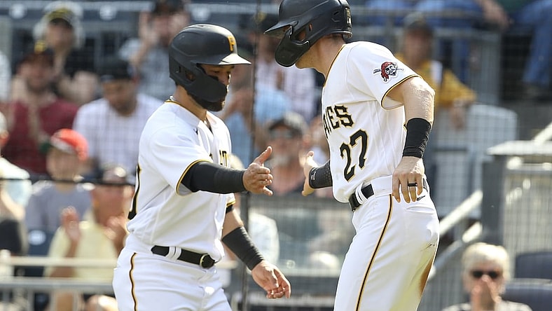 Jun 5, 2021; Pittsburgh, Pennsylvania, USA;  Pittsburgh Pirates left fielder Ka'ai Tom (left) and shortstop Kevin Newman (27) celebrate after scoring runs against the Miami Marlins during the second inning at PNC Park. Mandatory Credit: Charles LeClaire-USA TODAY Sports