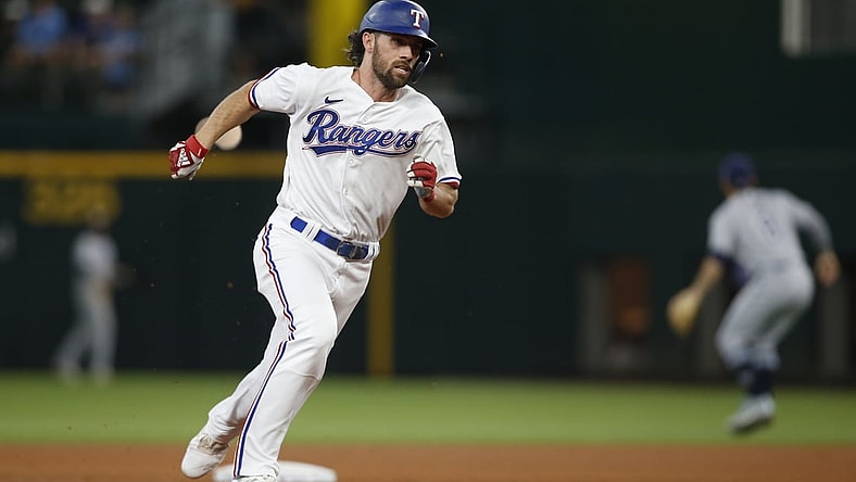 Jun 5, 2021; Arlington, Texas, USA; Texas Rangers third baseman Charlie Culberson (2) runs to third base after hitting a triple during the fifth inning against the Tampa Bay Rays at Globe Life Field. Mandatory Credit: Tim Heitman-USA TODAY Sports