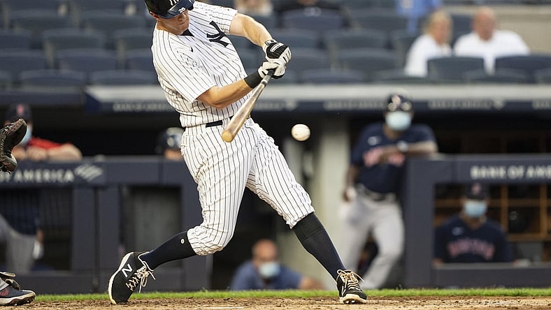 Jun 5, 2021; Bronx, New York, USA;  New York Yankees second baseman DJ LeMahieu (26) hits a single during the third inning at Yankee Stadium. Mandatory Credit: Gregory Fisher-USA TODAY Sports