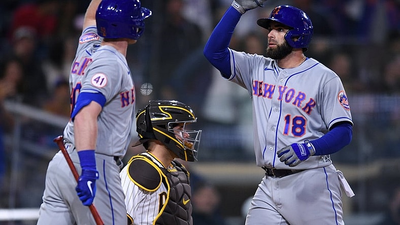 Jun 5, 2021; San Diego, California, USA; New York Mets second baseman Jose Peraza (18) is congratulated by right fielder Billy McKinney (left) after hitting a home run against the San Diego Padres during the fifth inning at Petco Park. Mandatory Credit: Orlando Ramirez-USA TODAY Sports