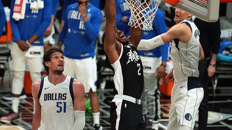 Jun 6, 2021; Los Angeles, California, USA; Los Angeles Clippers forward Kawhi Leonard (2) moves in for a basket against Dallas Mavericks center Kristaps Porzingis (6) and center Boban Marjanovic (51) during the second half in game seven of the first round of the 2021 NBA Playoffs. at Staples Center. Mandatory Credit: Kirby Lee-USA TODAY Sports