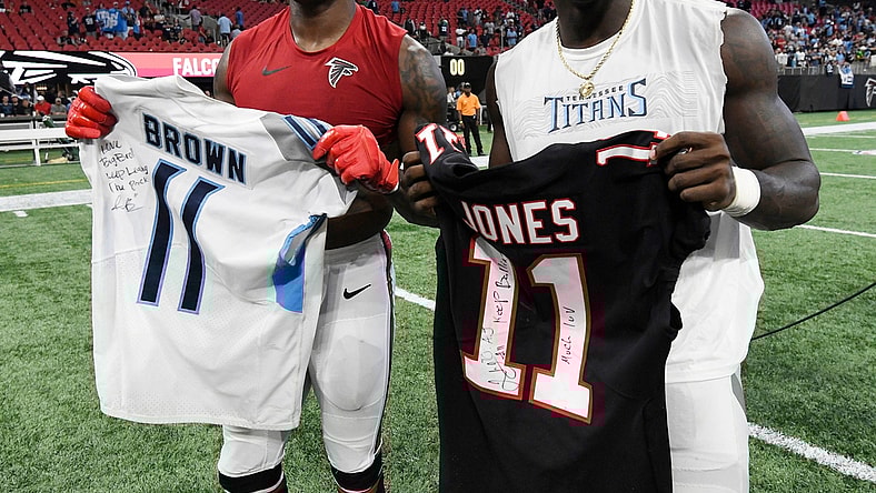 Atlanta Falcons wide receiver Julio Jones (11) and Tennessee Titans wide receiver A.J. Brown (11) exchange jerseys after the Titans' 24-10 win at Mercedes-Benz Stadium Sunday, Sept. 29, 2019 in Atlanta, Ga.