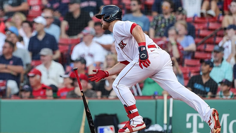 Jun 7, 2021; Boston, Massachusetts, USA; Boston Red Sox second baseman Christian Arroyo (39) hits a RBI single during the fourth inning against the Miami Marlins at Fenway Park. Mandatory Credit: Paul Rutherford-USA TODAY Sports
