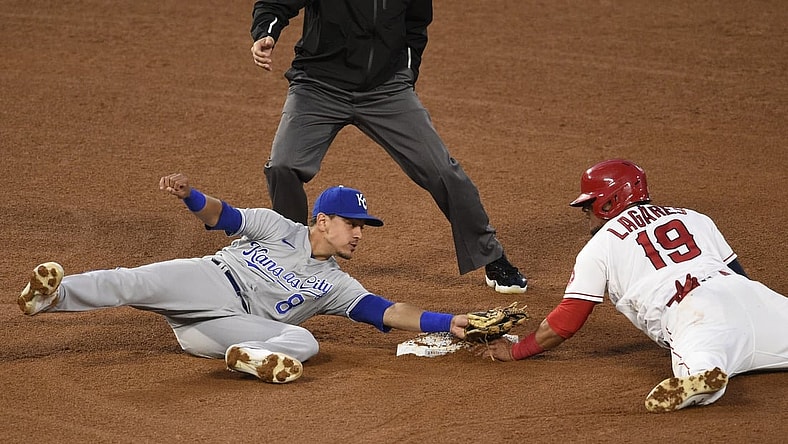 Jun 7, 2021; Anaheim, California, USA; Los Angeles Angels center fielder Juan Lagares (19) steals second base against Kansas City Royals shortstop Nicky Lopez (8) during the fourth inning at Angel Stadium. Mandatory Credit: Kelvin Kuo-USA TODAY Sports