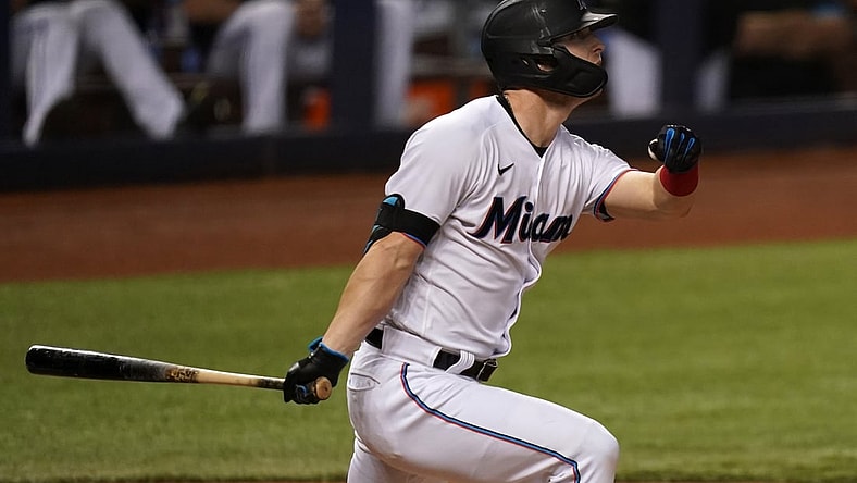 Jun 8, 2021; Miami, Florida, USA; Miami Marlins left fielder Corey Dickerson (23) triples in two runs in the 3rd inning against the Colorado Rockies at loanDepot park. Mandatory Credit: Jasen Vinlove-USA TODAY Sports