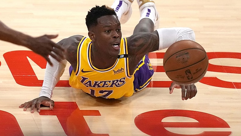 Jun 3, 2021; Los Angeles, California, USA; Los Angeles Lakers guard Dennis Schroder (17) reaches for the ball against the Phoenix Suns in the second half during game six in the first round of the 2021 NBA Playoffs. at Staples Center. Mandatory Credit: Kirby Lee-USA TODAY Sports