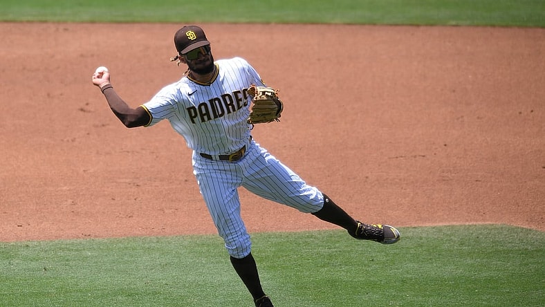 Jun 9, 2021; San Diego, California, USA; San Diego Padres shortstop Fernando Tatis Jr. (23) throws to first base on a ground out Chicago Cubs catcher P.J. Higgins (not pictured) during the third inning at Petco Park. Mandatory Credit: Orlando Ramirez-USA TODAY Sports