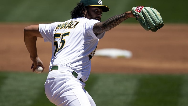 Jun 9, 2021; Oakland, California, USA; Oakland Athletics starting pitcher Sean Manaea (55) delivers a pitch against the Arizona Diamondbacks during the second inning at RingCentral Coliseum. Mandatory Credit: D. Ross Cameron-USA TODAY Sports